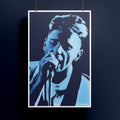 Poster featuring a stylized portrait of New Order's Bernard Sumner with a microphone on a dark background